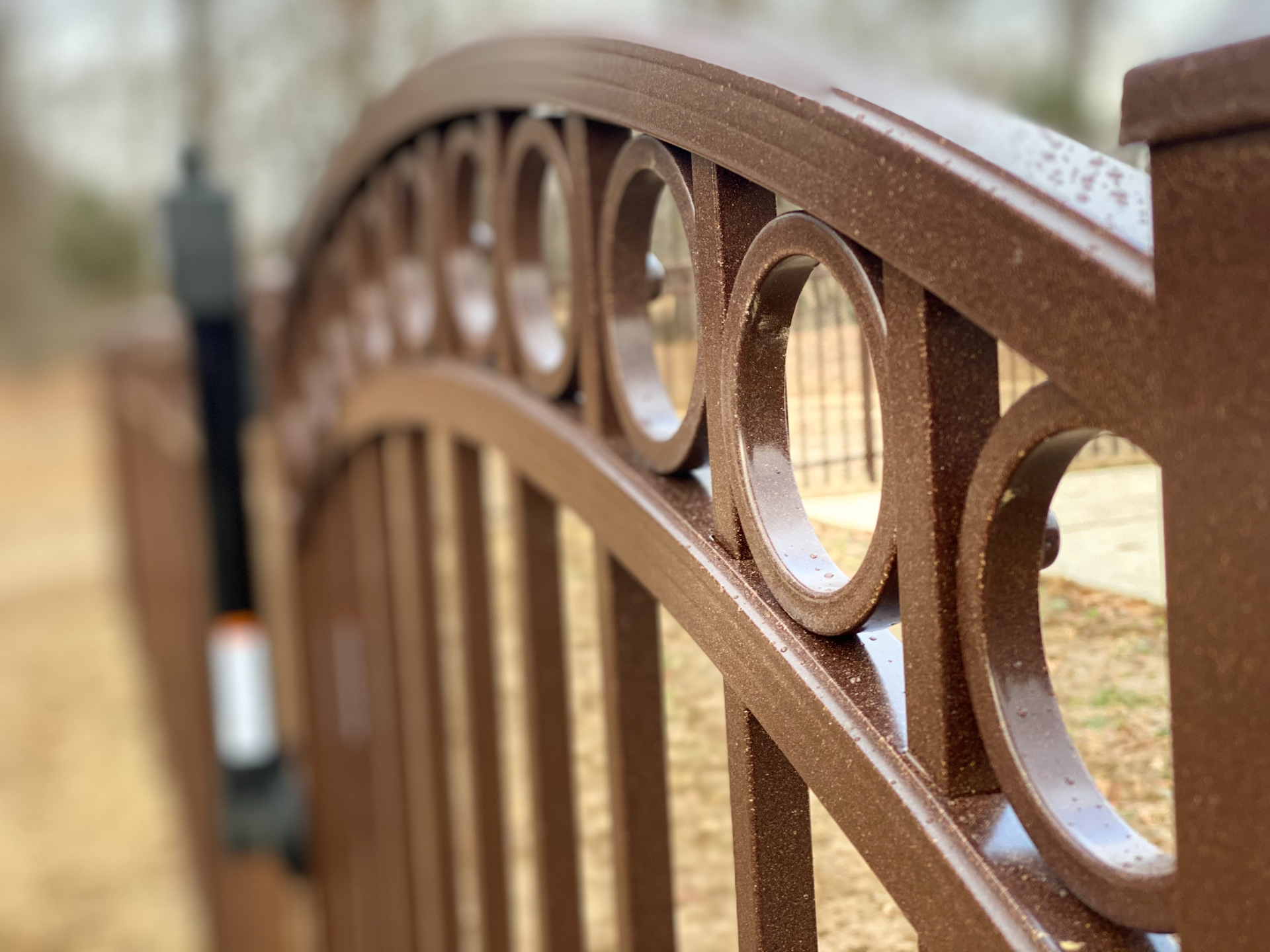 A wrought iron fence is shown on a white background.