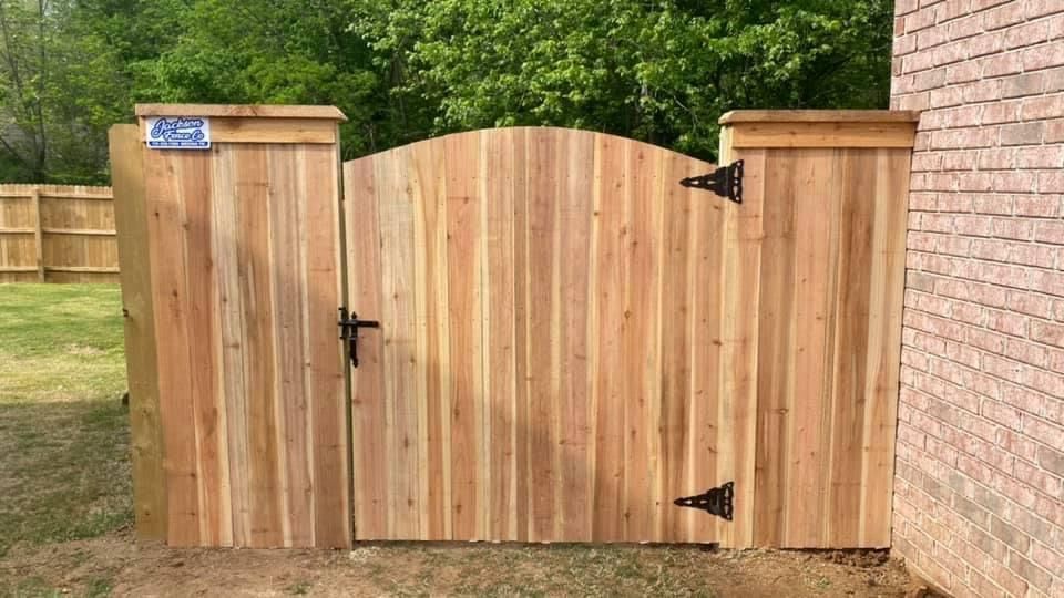 A wooden fence with a post on a white background.