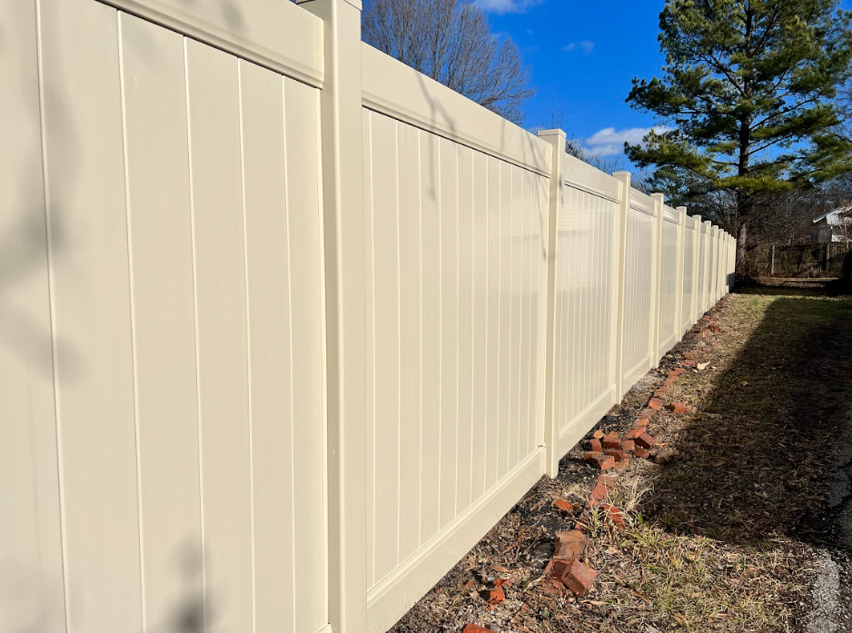 A gray fence with white stripes on a white background.