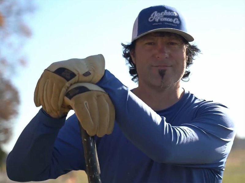 A man wearing a hat that says anchor on it