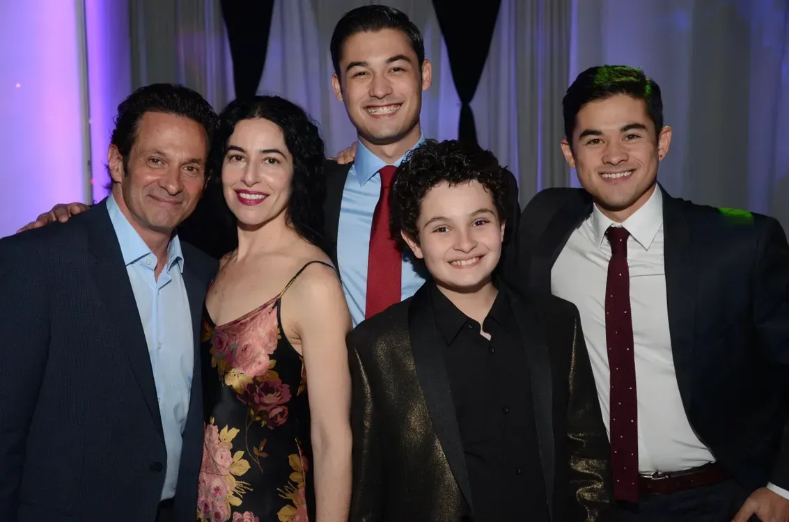 A group of people are posing for a picture together.