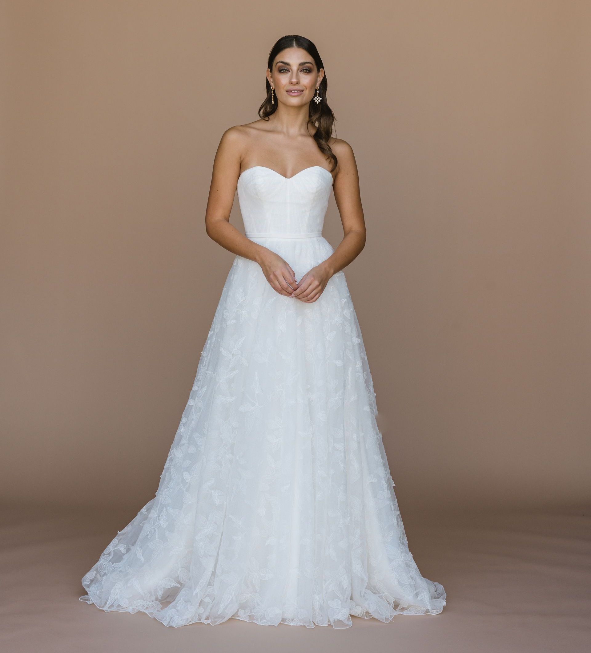 Floral lace overlay wedding dress. strapless aline