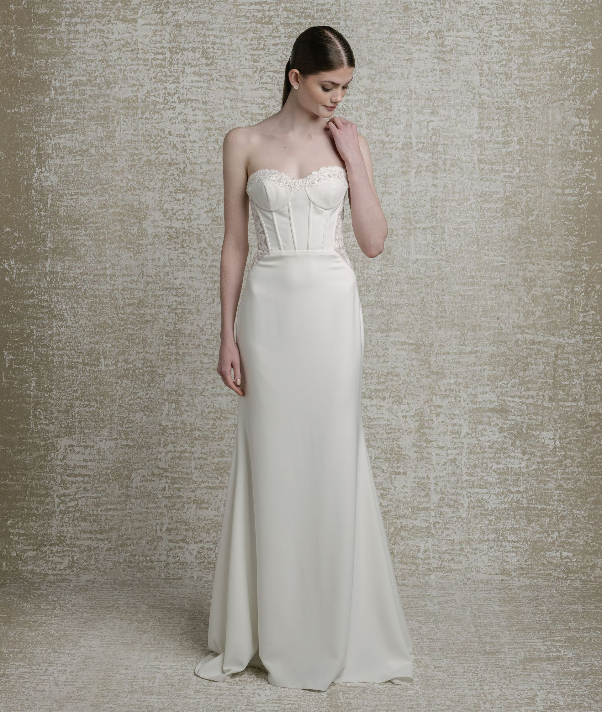 Mikado crepe, sweetheart neckline with decorative boning and sequinned lace cutouts