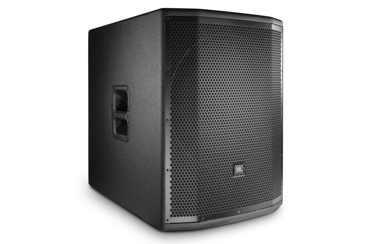 A black speaker is sitting on top of a white surface.