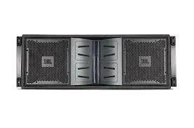 A jbl speaker is sitting on top of a white surface.