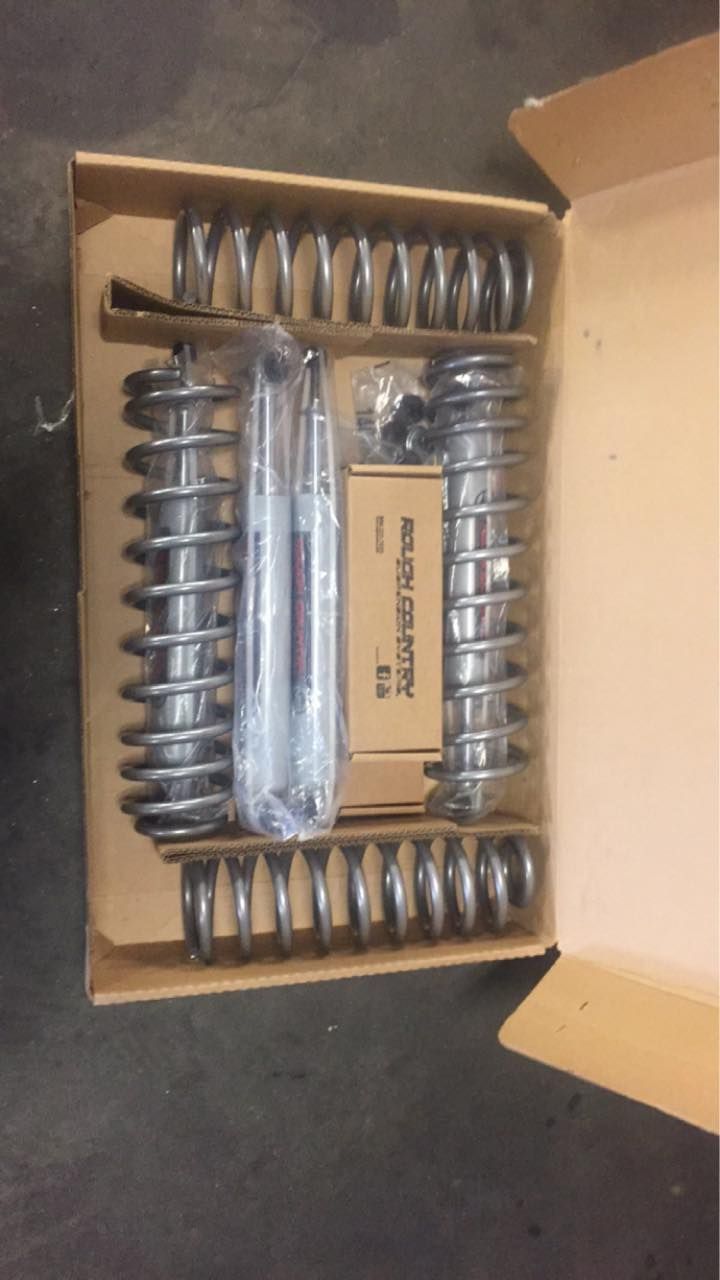 A cardboard box with a bunch of springs in it