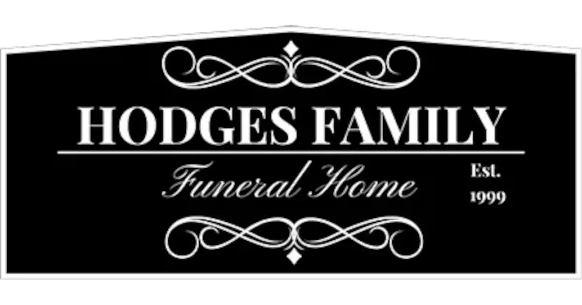 Hodges Family Funeral Home sign, black and white, ornate scrollwork, 