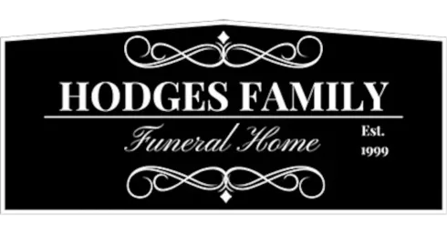 Hodges Family Funeral Home sign, black and white, ornate scrollwork, 