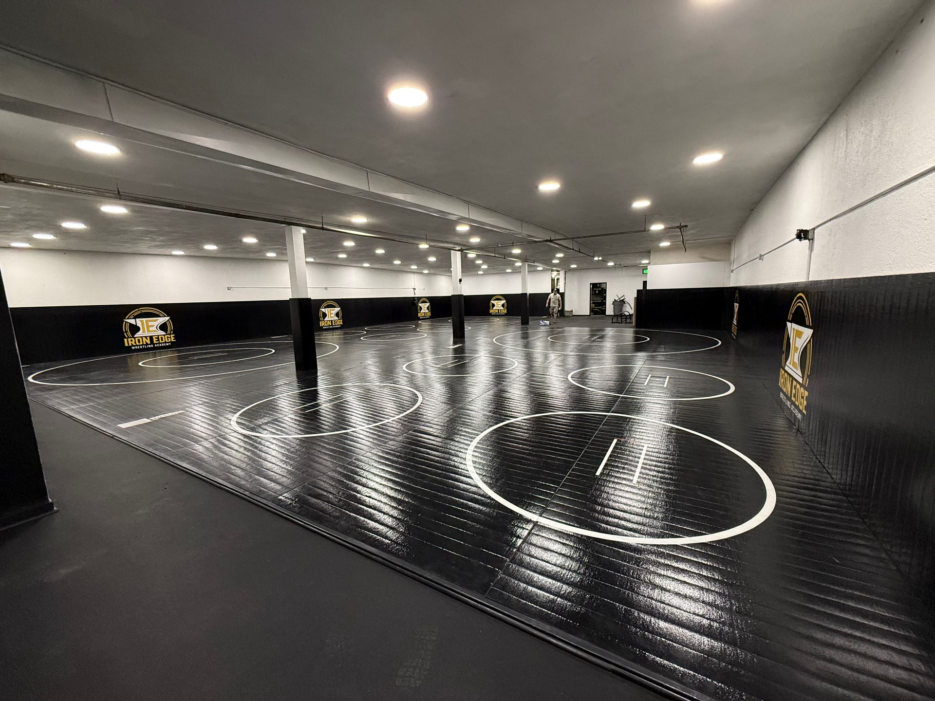 State of the art wrestling facility with brand new mats, wall mats, and workout equipment  