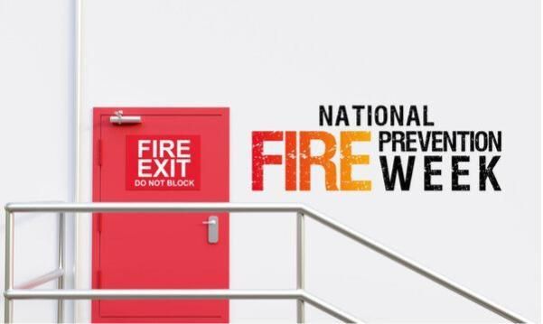 National fire prevention week logo by a fire exit