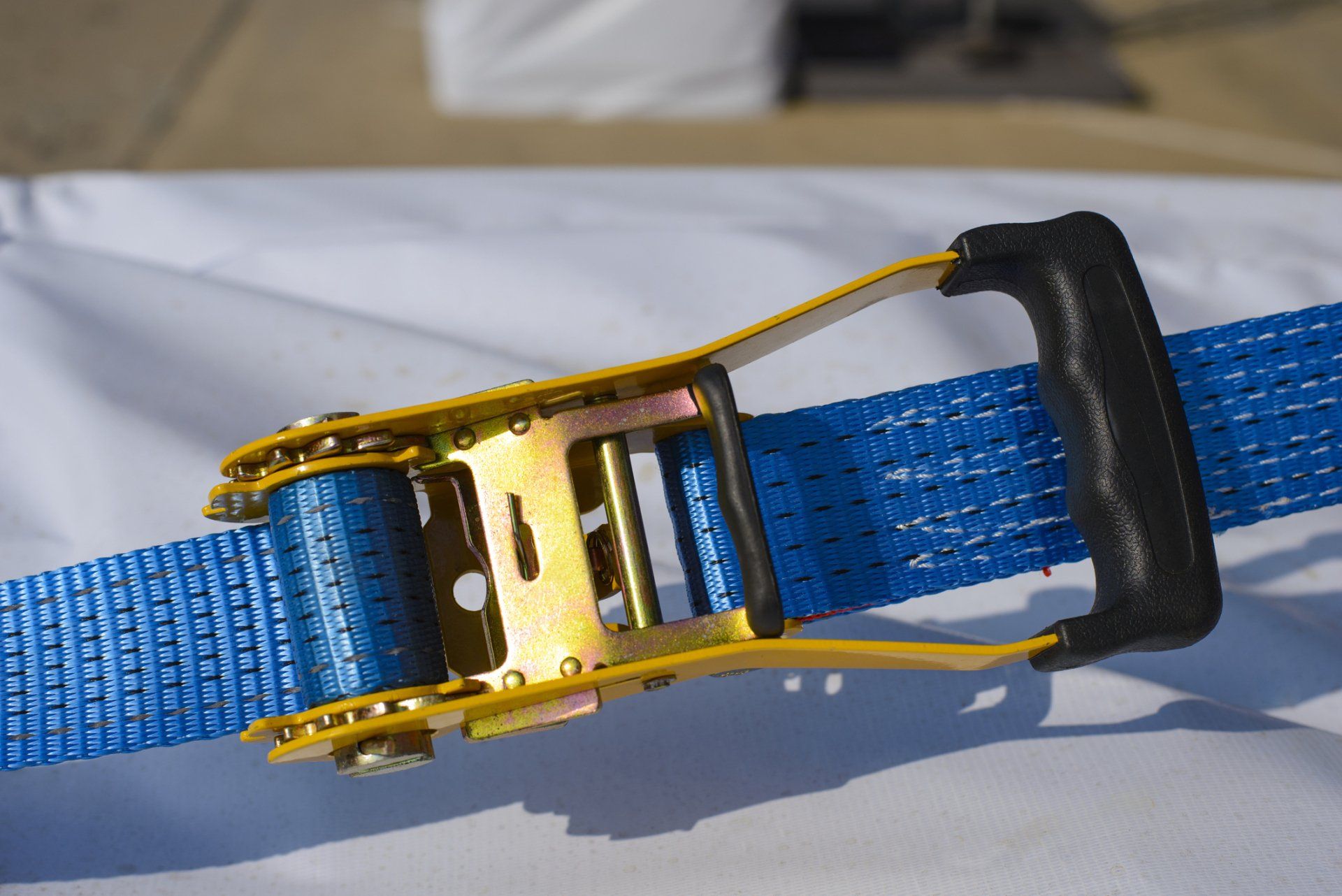 Blue And Gold Tie Down Strap — Sun City, AZ — Derrick Hickman Mobile Home Services — Sun City, AZ — Derrick Hickman Mobile Home Services