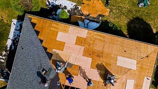 damaged roof being fixed by local roofer, Riverside Roofing in Marysville WA