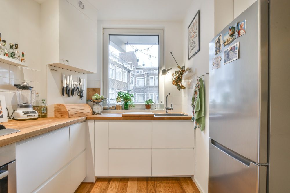 Kitchen with white cabinets and a stainless steel refrigerator in Union City, CA kitchen remodel.