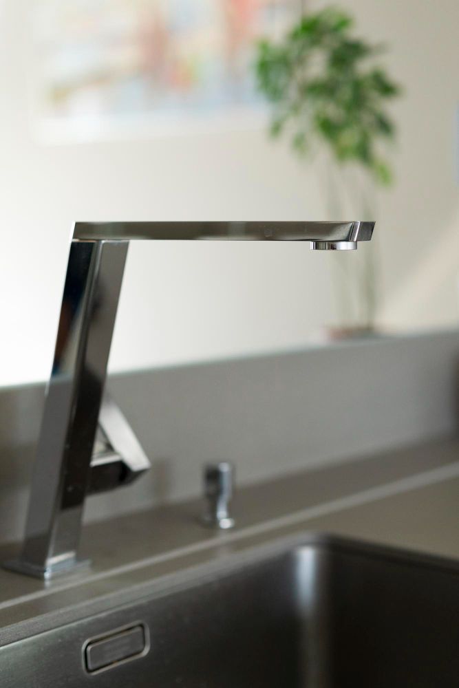 Close up of a smart kitchen sink with a faucet in Union City CA kitchen remodel.