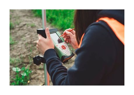 Female Land Surveyor taking measurements