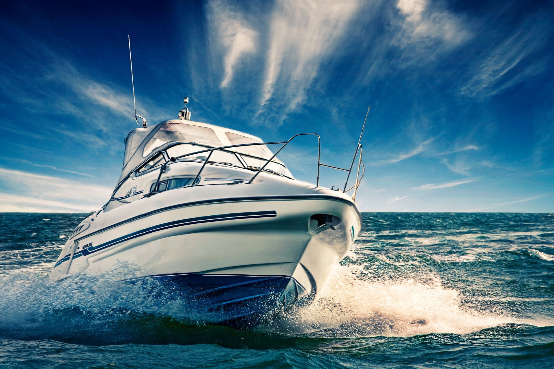 Smooth-sailing boat on lake showcasing calm trip covered by boat insurance policy