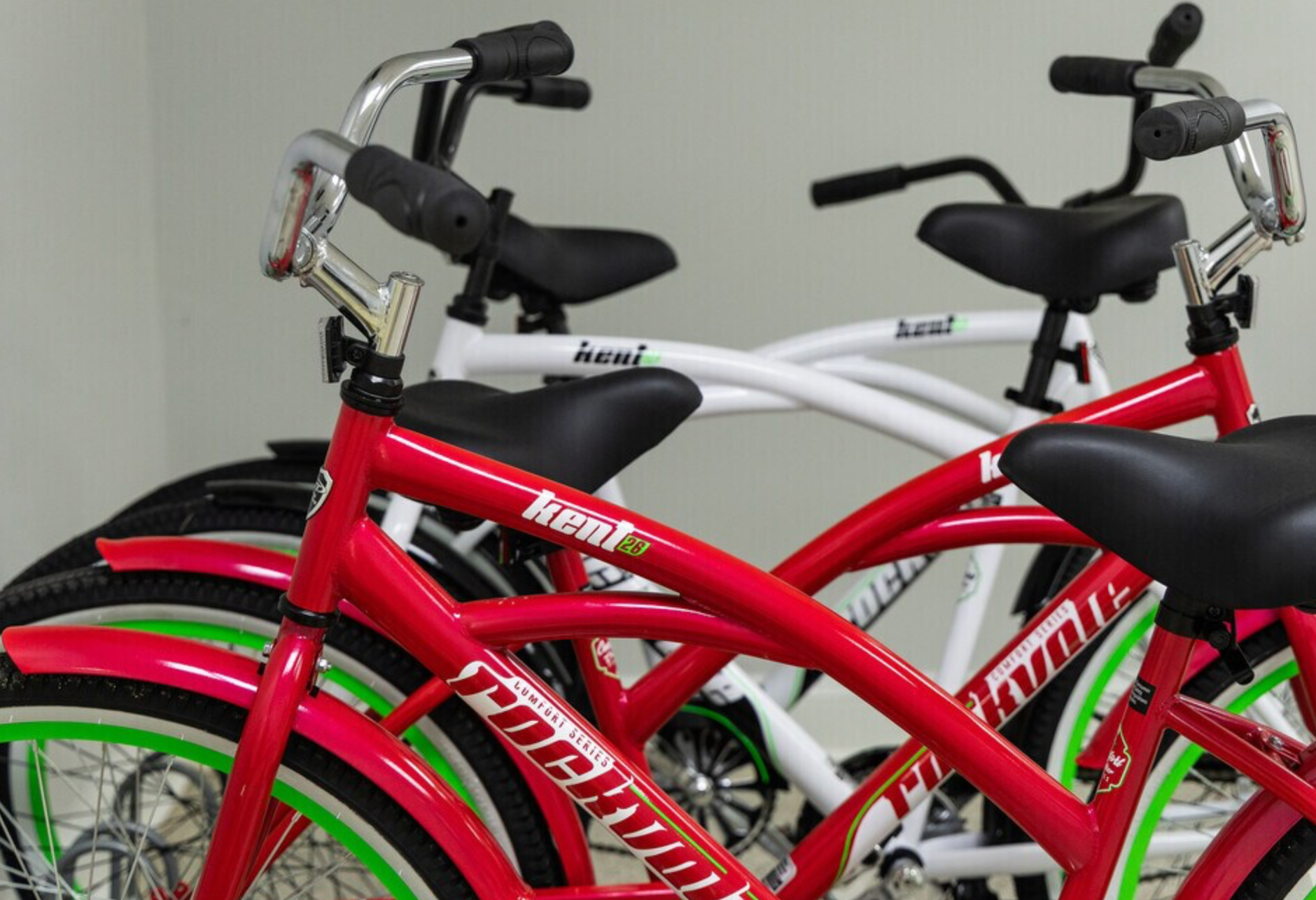 A row of red and white bikes with the word cobra on the front