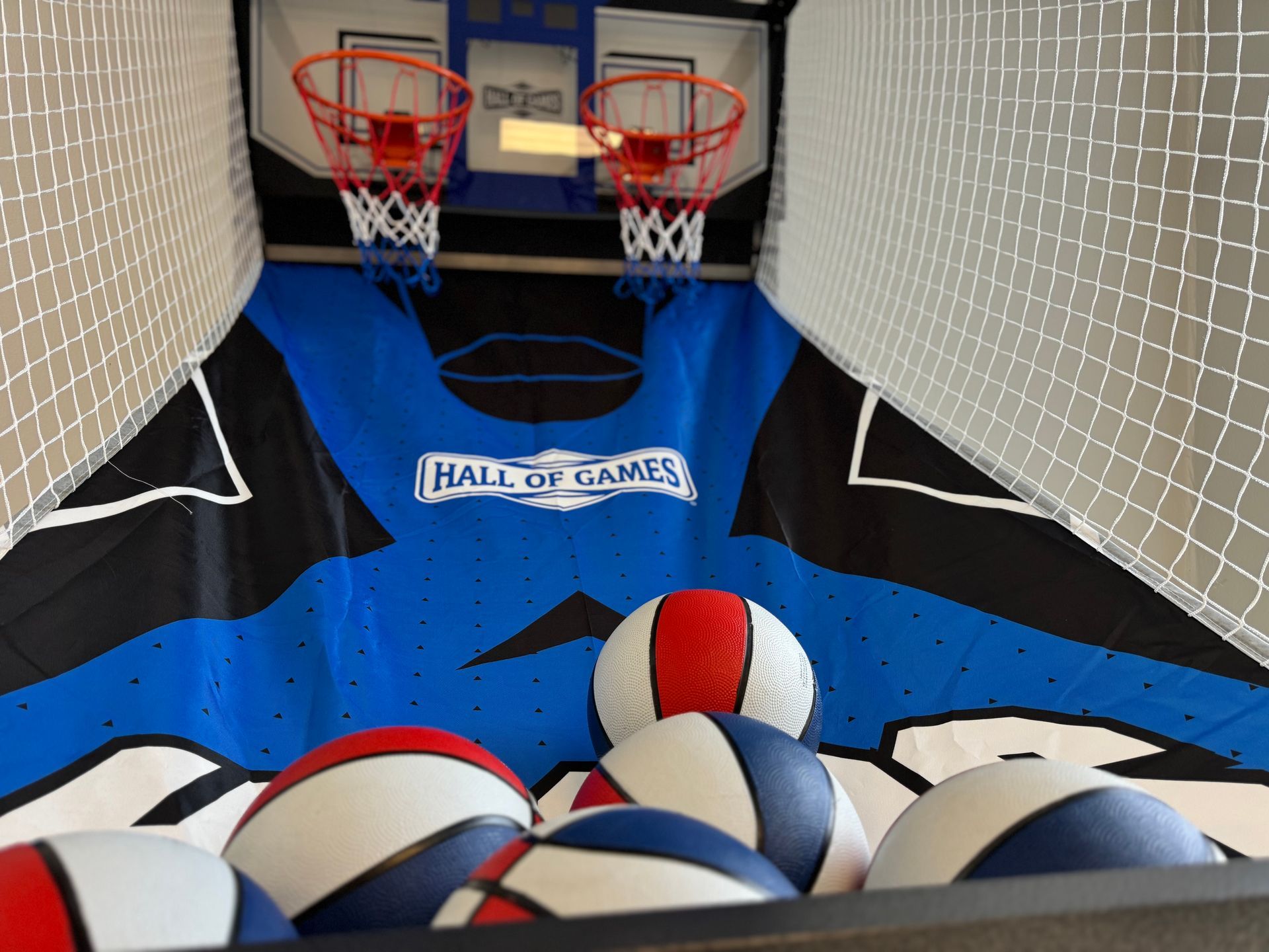 A hall of games basketball game with a bunch of balls