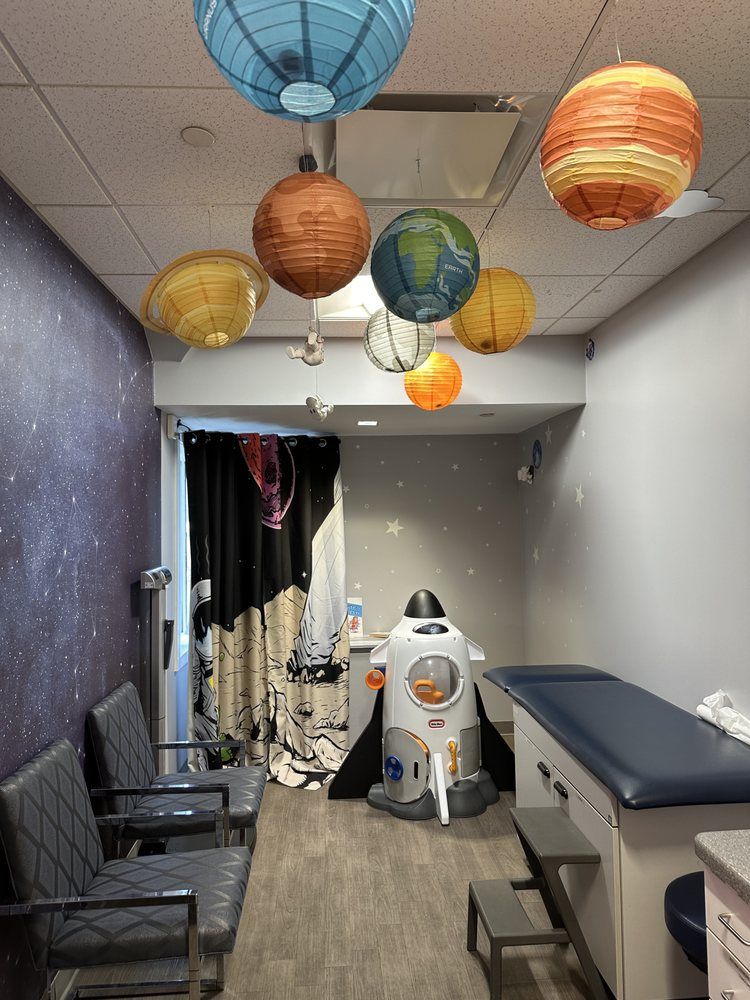 A doctor 's office with paper lanterns hanging from the ceiling