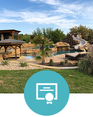 A large swimming pool with a slide in the backyard