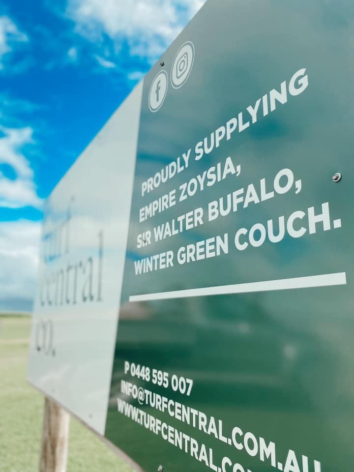 A Sign That Says Proudly Supplying on It — Turf Central In Chelona, QLD