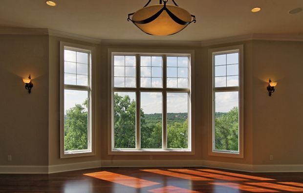 sun coming through a window into a living room with hardwood floors