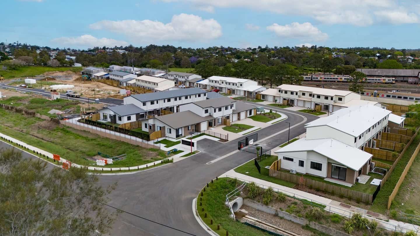 An Aerial View of a Residential Area With Lots of Houses and Trees.