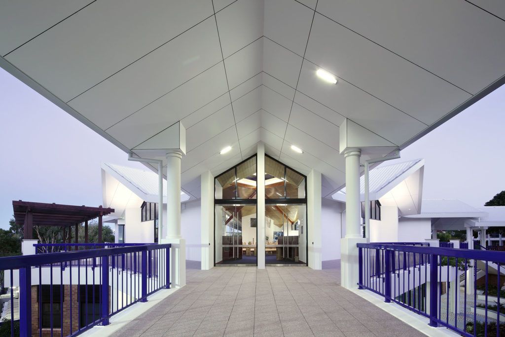 A Bridge Leading to a Building With a Purple Railing — JIC Projects Pty Ltd in Runaway Bay, QLD