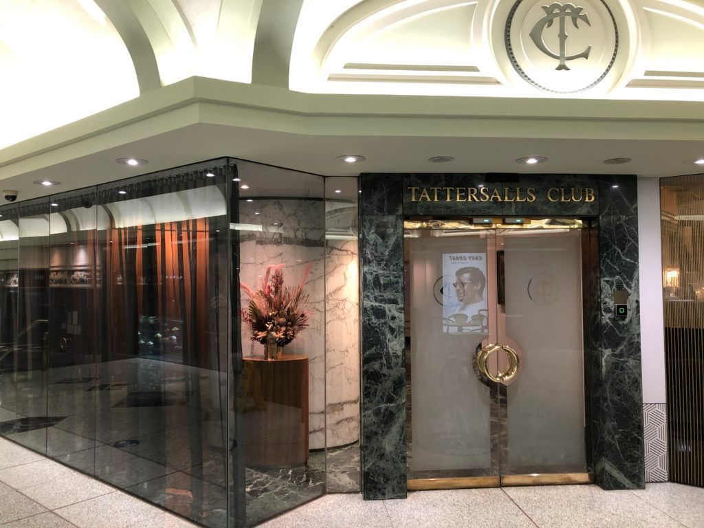 A Building With a Glass Door and a Sign That Says Tattersall 's Club — JIC Projects Pty Ltd in Runaway Bay, QLD