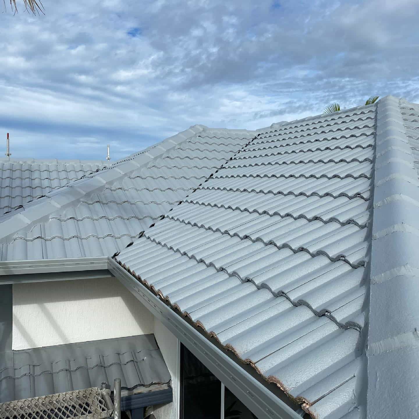 A Roof of a House With a Blue Sky in the Background — JIC Projects Pty Ltd in Runaway Bay, QLD