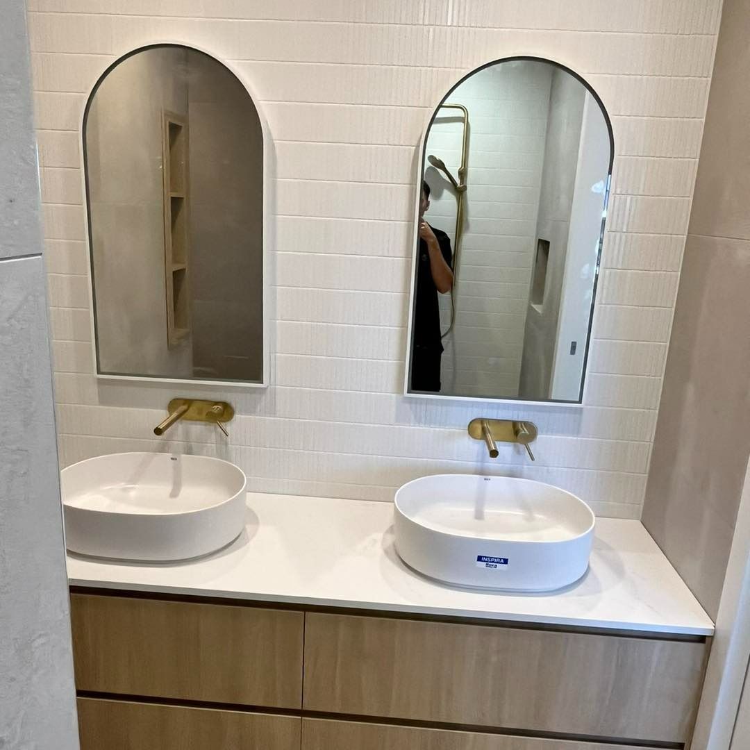 A Bathroom With Two Sinks and Two Mirrors — JIC Projects Pty Ltd in Runaway Bay, QLD