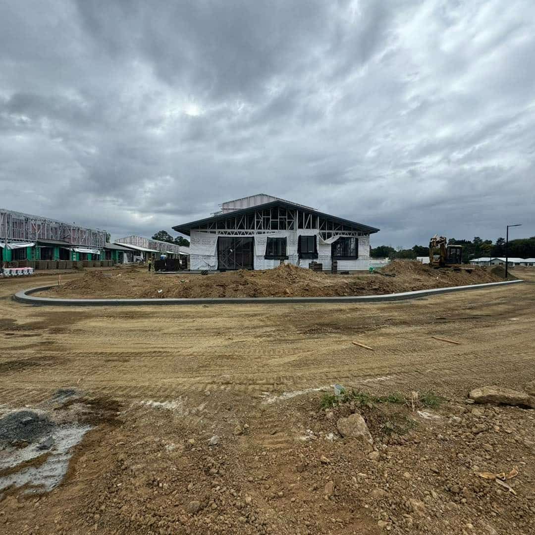 A Large White House is Being Built in a Dirt Field — JIC Projects Pty Ltd in Runaway Bay, QLD