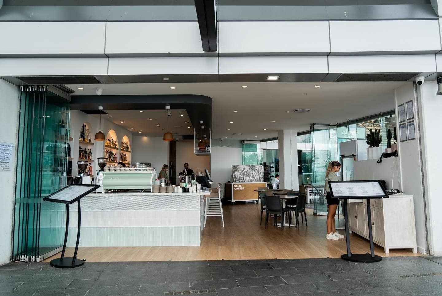 A Restaurant With a Sliding Glass Door and a Counter — JIC Projects Pty Ltd in Runaway Bay, QLD