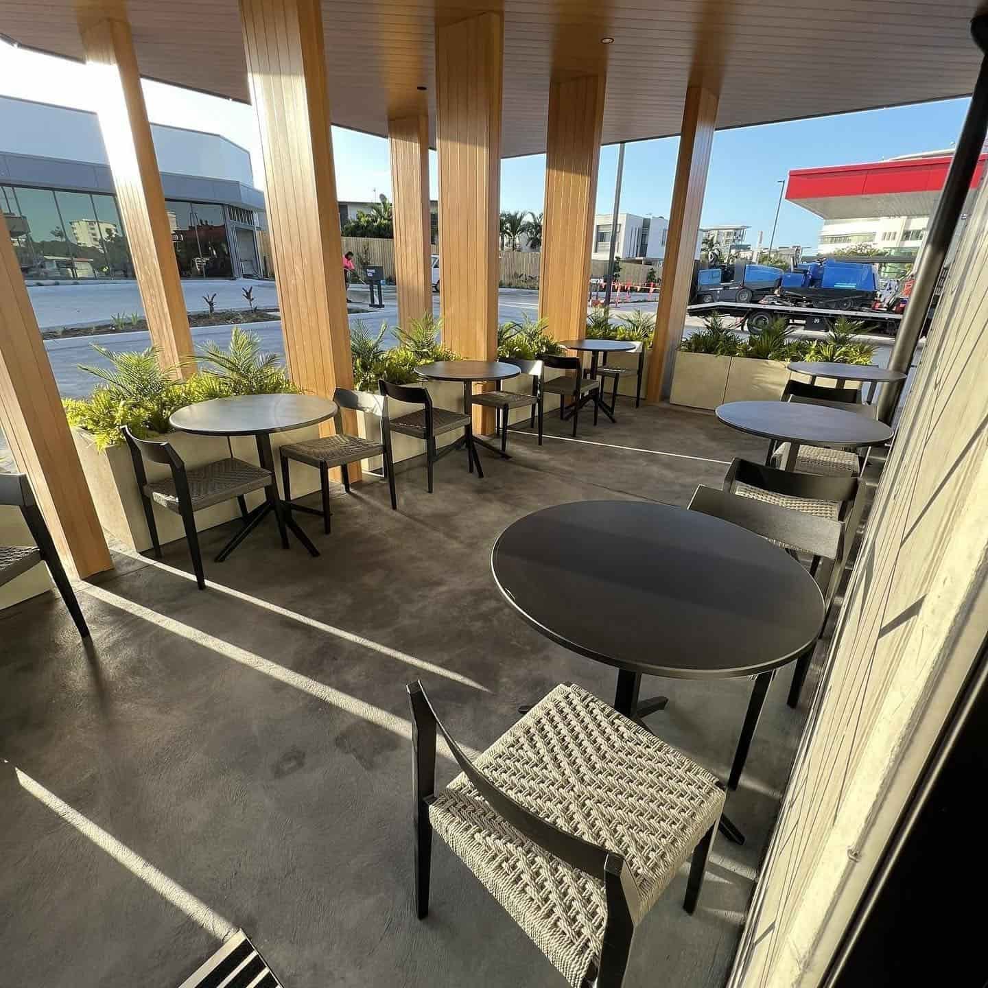 A Patio With Tables and Chairs in a Restaurant — JIC Projects Pty Ltd in Runaway Bay, QLD