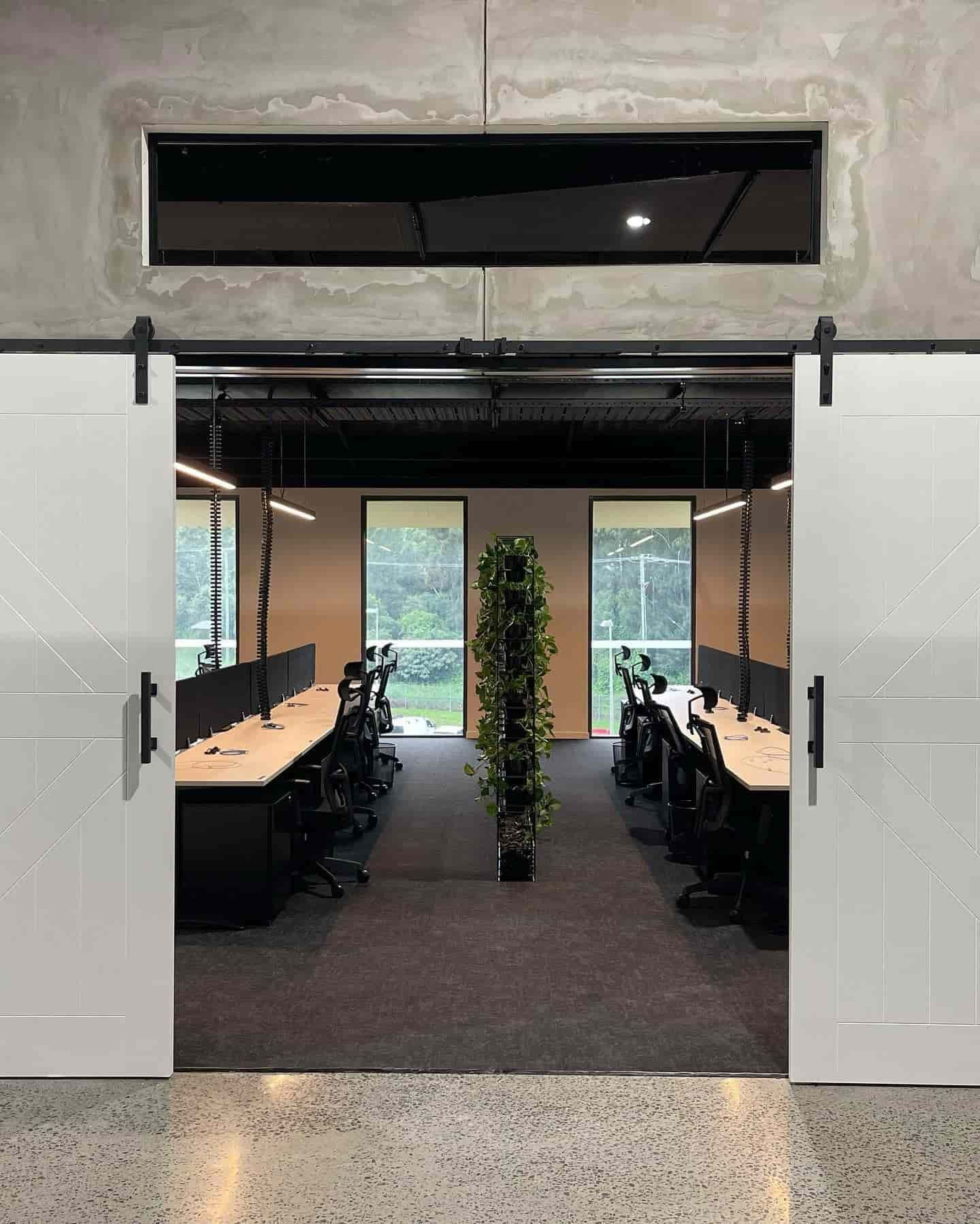 A Room With a Lot of Desks and Chairs and a Sliding Barn Door — JIC Projects Pty Ltd in Runaway Bay, QLD