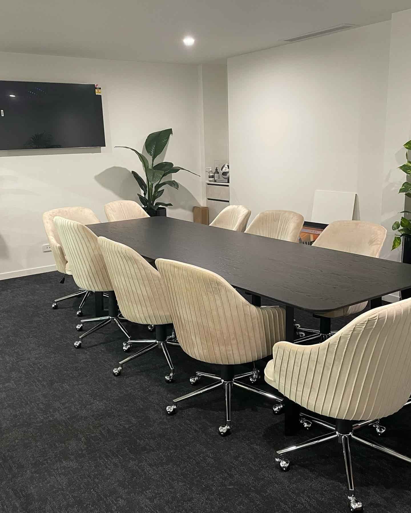 A Conference Room With a Long Table and Chairs and a Flat Screen TV — JIC Projects Pty Ltd in Runaway Bay, QLD