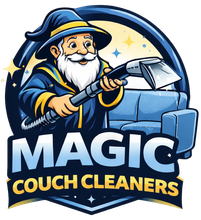 A logo showing a smiling wizard using a vacuum wand to clean a blue couch, with the text "MAGIC COUCH CLEANERS."