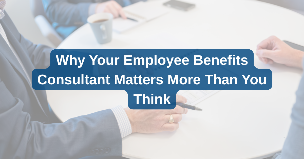 Business professionals in suits sit at a conference table with the text