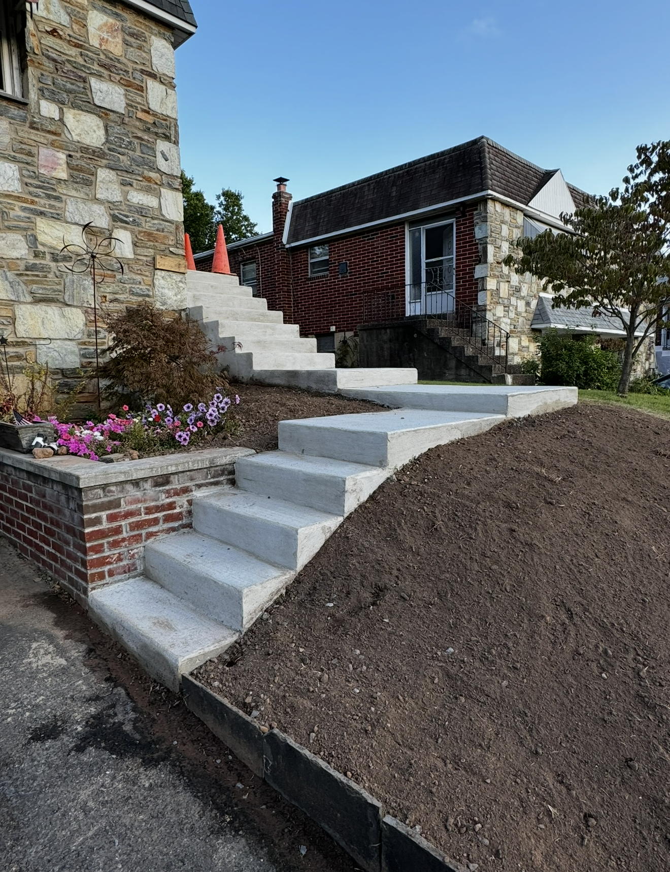 A set of stairs leading up to a stone house.