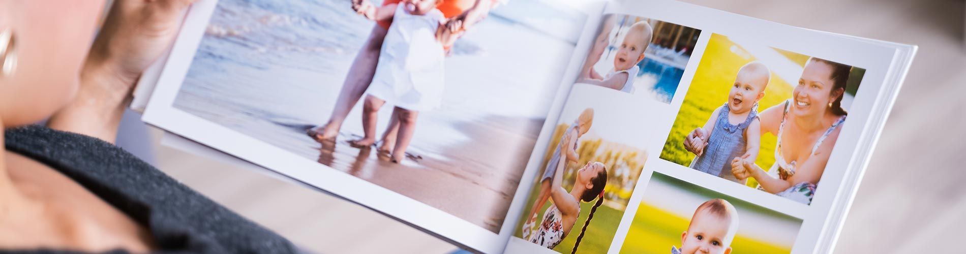 open photo book showing pictures of a baby and mom