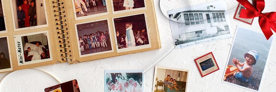 photographs on a table and an old album and photo slides.