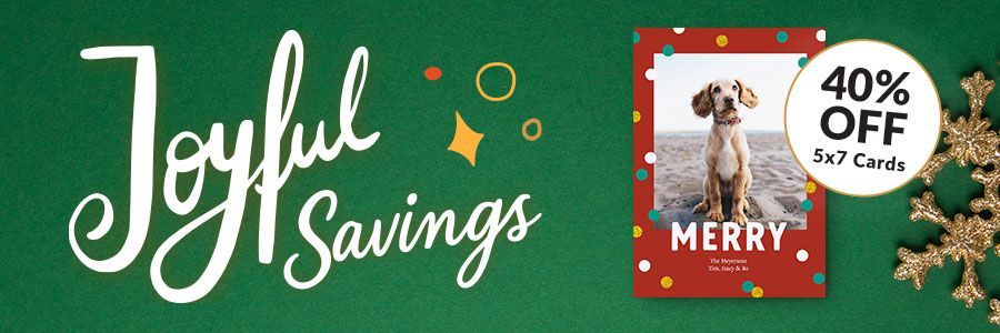 A variety of holiday and Christmas Cards on a table.