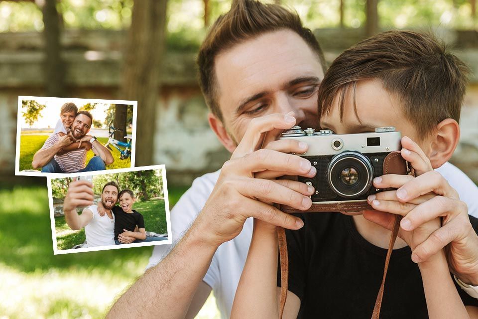 A person is holding a photo album with pictures of a child with their mother and grandmother