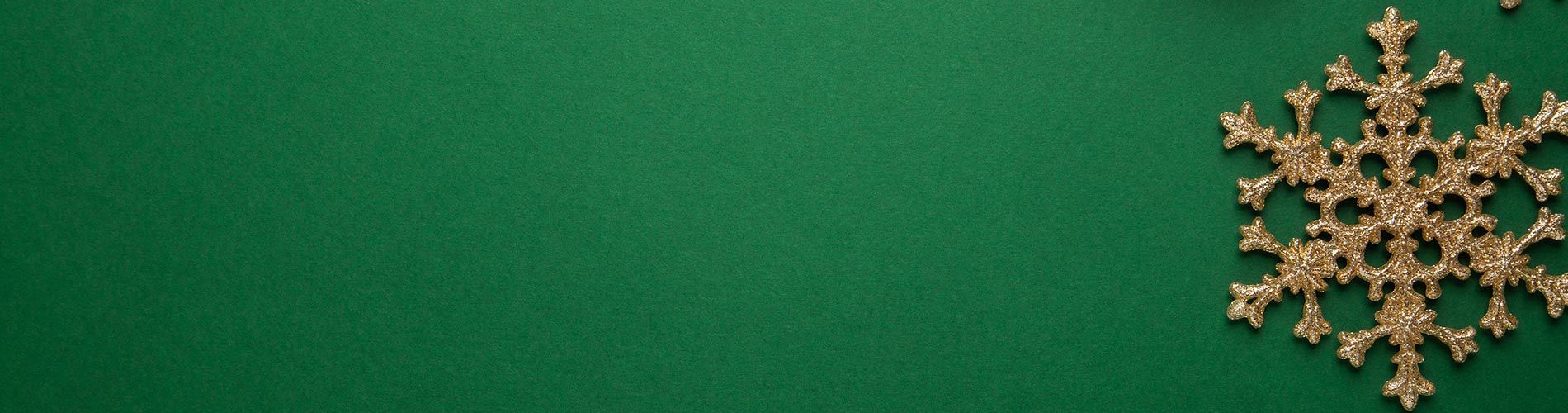 green background with gold snowflake