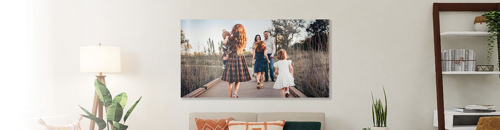 metal print of a family on a wall in a living room