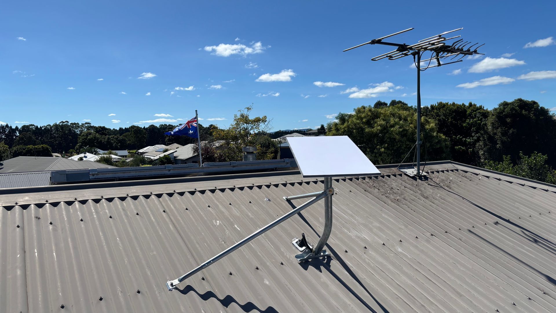 A Rooftop With a Satellite Dish, an Antenna — Wide Area Communications in Blue Mountains, NSW