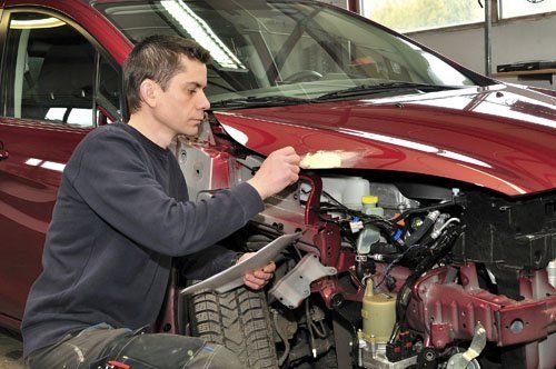 Checking Car Damage - Car Body Repair in Des Moines, IA