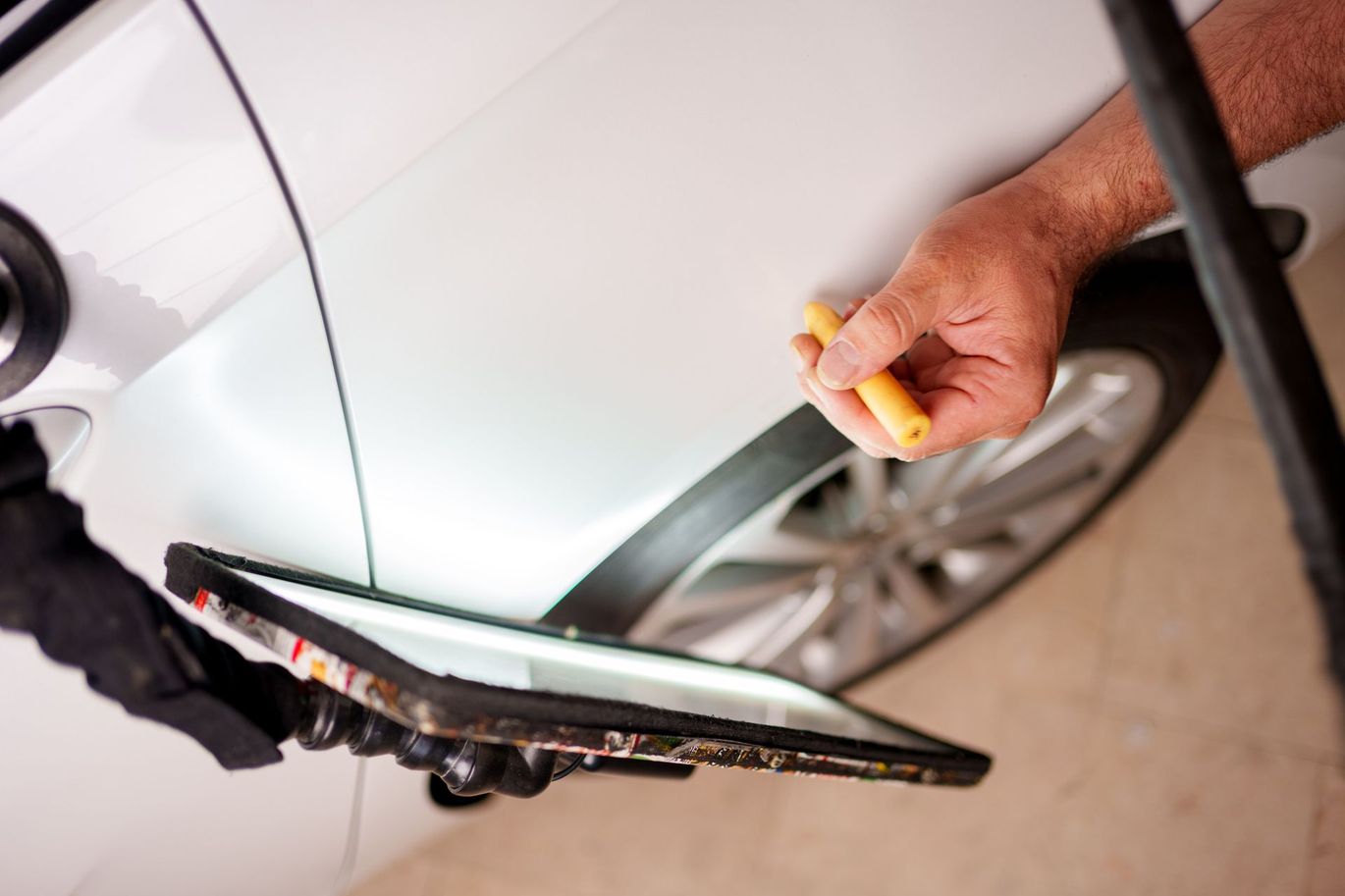 Repairing dents on car body.
