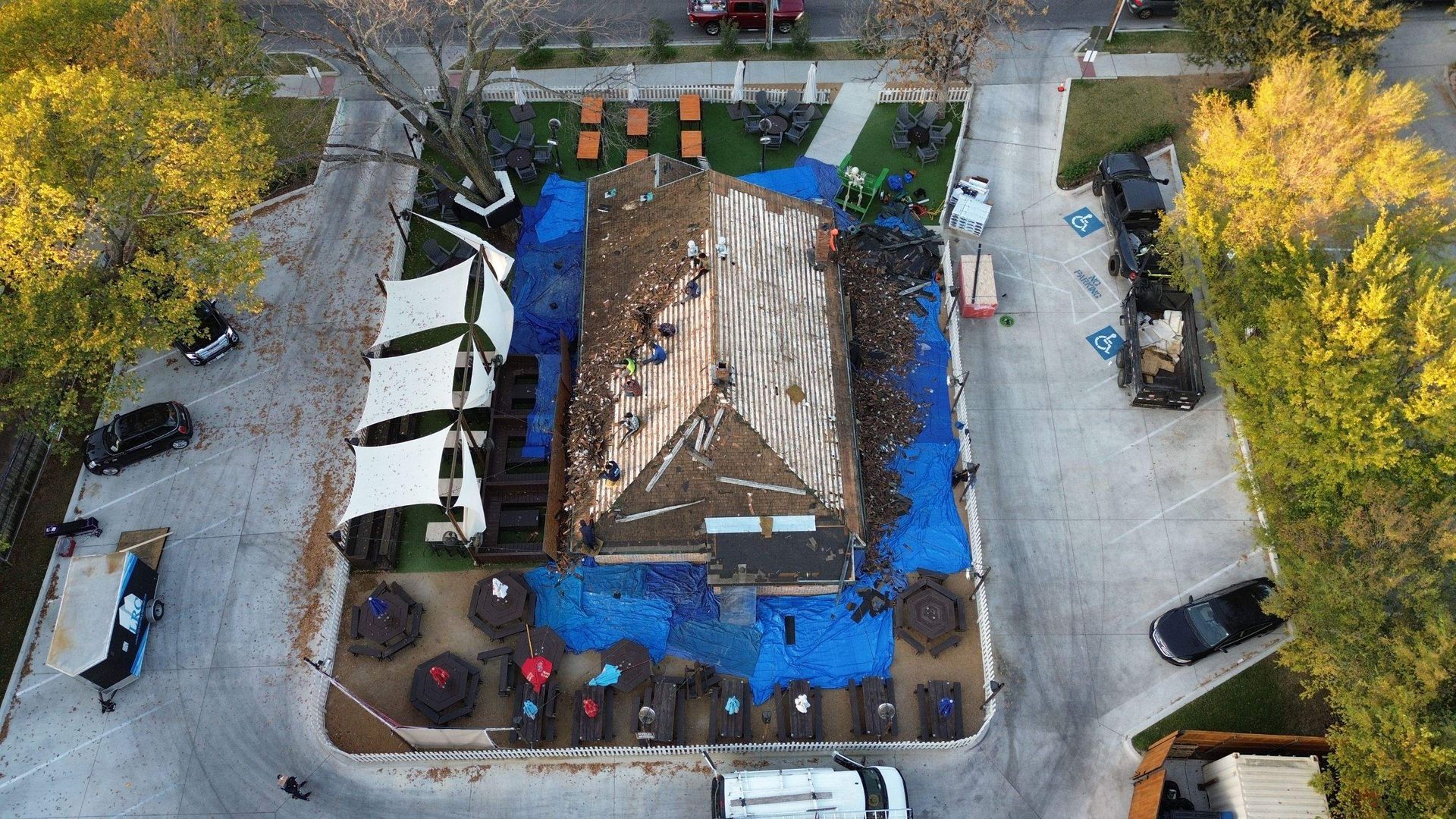 An aerial view of a building being built in a park.
