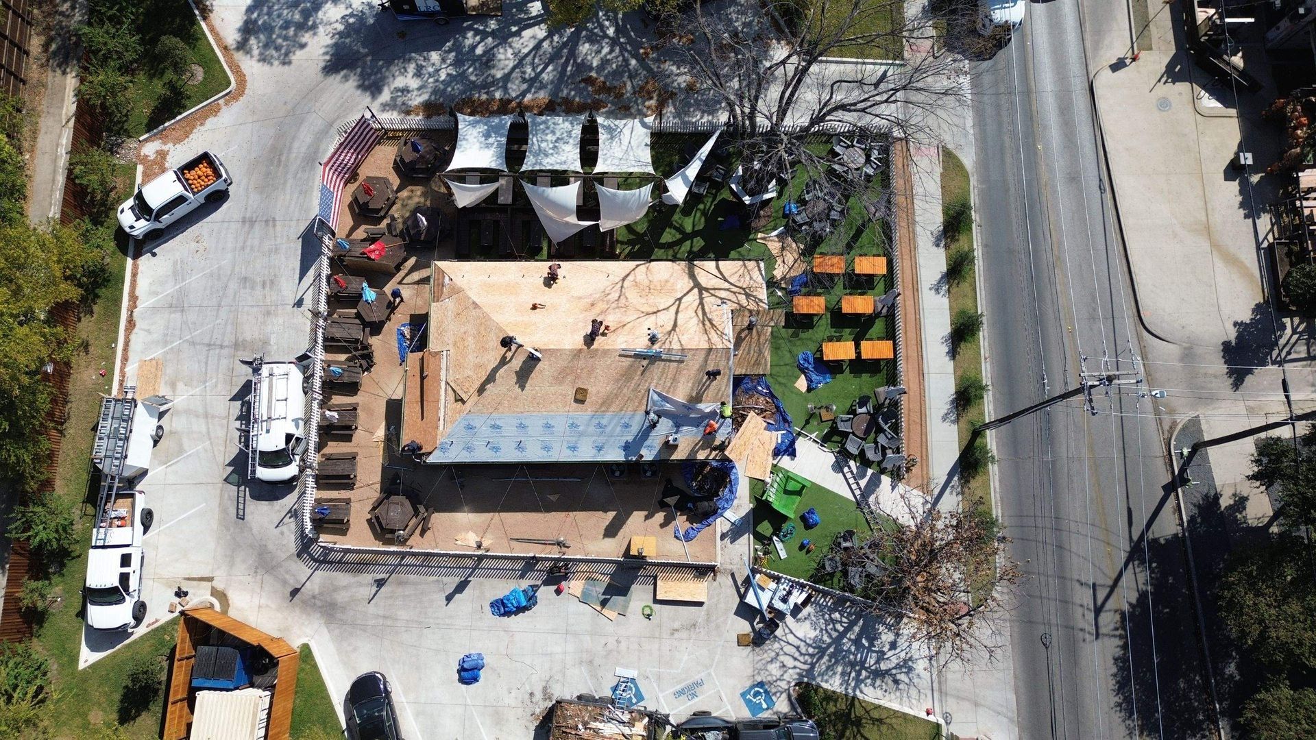 An aerial view of a construction site with a building under construction